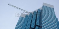 2481326-un-rascacielos-con-la-construccion-de-vidrio-tintado-azul-en-el-primer-plano-una-grua-en-el-fondo 2481326-un-rascacielos-con-la-construccion-de-vidrio-tintado-azul-en-el-primer-plano-una-grua-en-el-fondo